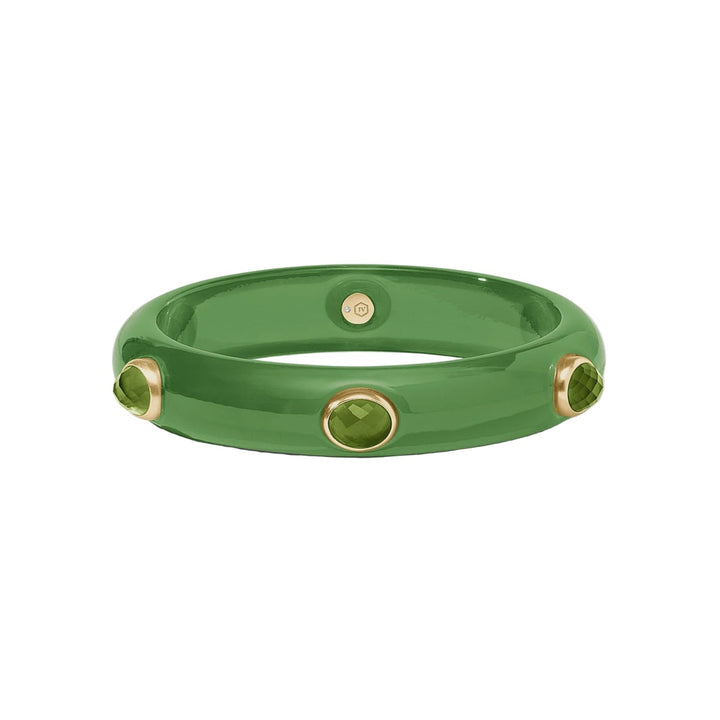Handcrafted ceramic jewelry by Ippolita featuring a glossy forest green bangle bracelet centered on a white background with three faceted green gemstones in gold bezel settings and a visible interior hallmark