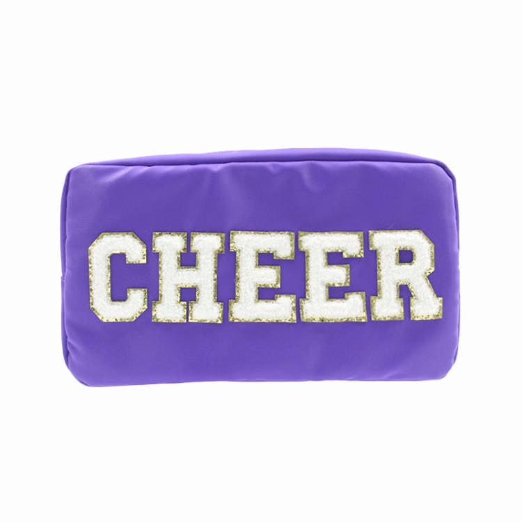 Nylon fabric pouch featuring the word CHEER in white chenille varsity patches with shimmering gold glitter borders on a purple background set against a plain white studio backdrop