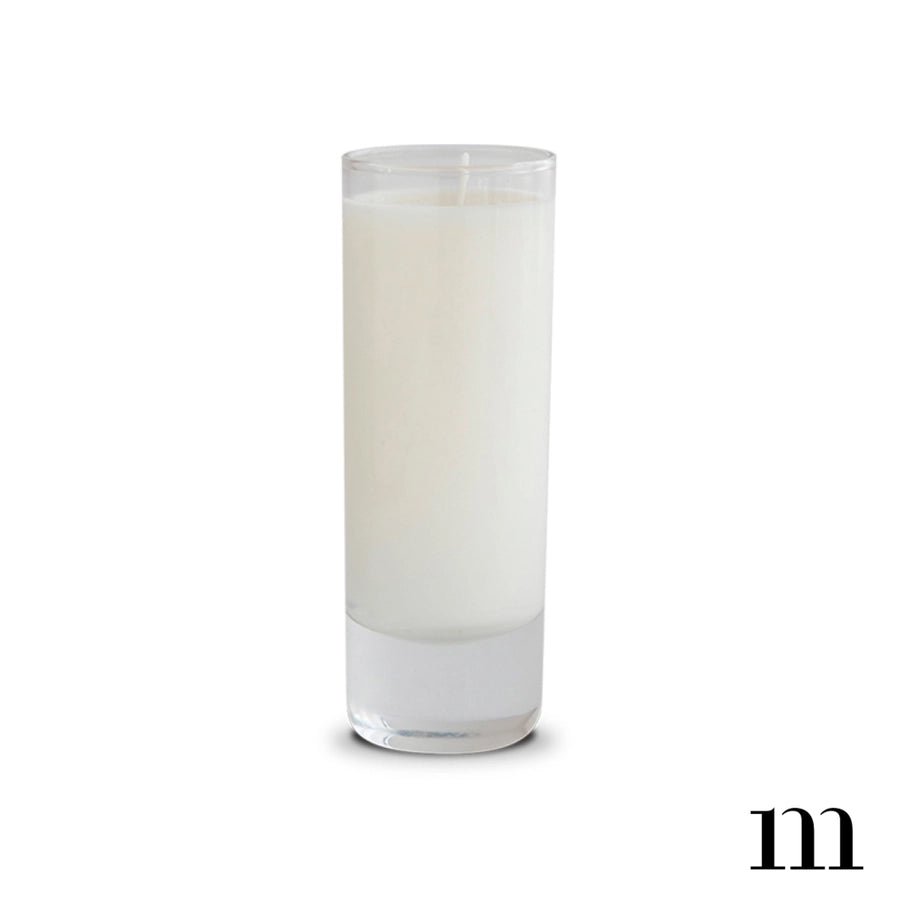Product photograph of a creamy white wax candle in a tall slender glass jar on a plain white background featuring a thick weighted base and a single centered unlit wick
