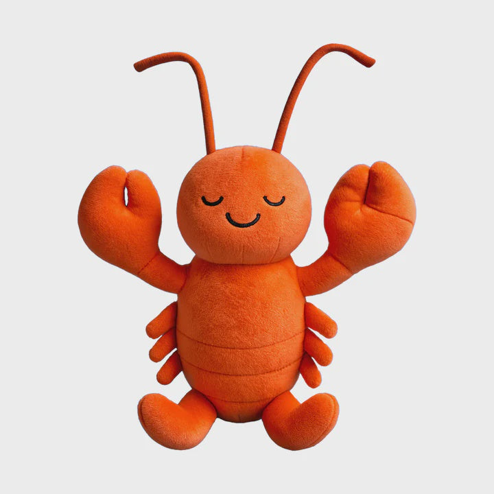 Plush toy by Jellycat depicting a cheerful orange lobster centered on a light neutral background with a hand-stitched smiling face, two large plush claws, and long curved antennae