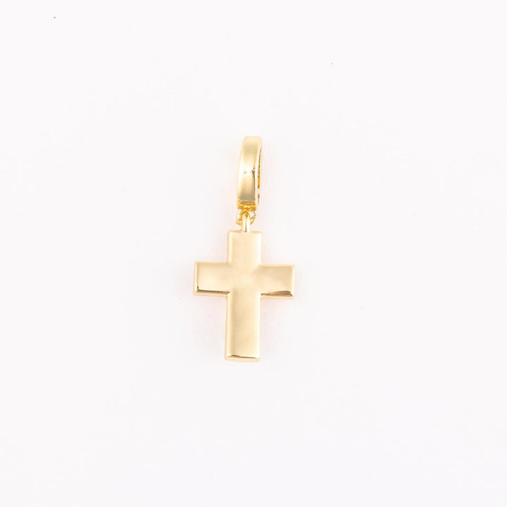 Yellow gold cross pendant featuring a classic Latin cross silhouette with a highly polished finish and an attached rounded bail centered on a plain white studio background