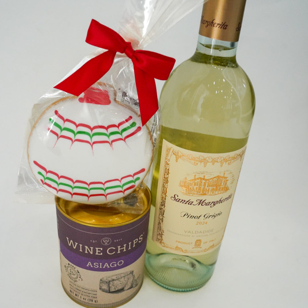 Bottle of wine with a cookie and a bag of chips on a white background