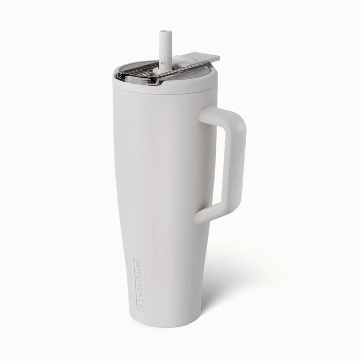 Product photograph by BrüMate of a matte white insulated Era tumbler featuring an ergonomic handle, a clear leak-proof lid with a built-in straw, and embossed branding against a plain background
