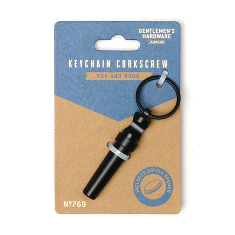 Product photography by Gentlemen's Hardware featuring a matte black keychain corkscrew with a split ring attached to a blue and tan cardboard backing with the Pop and Pour slogan and model number No 769