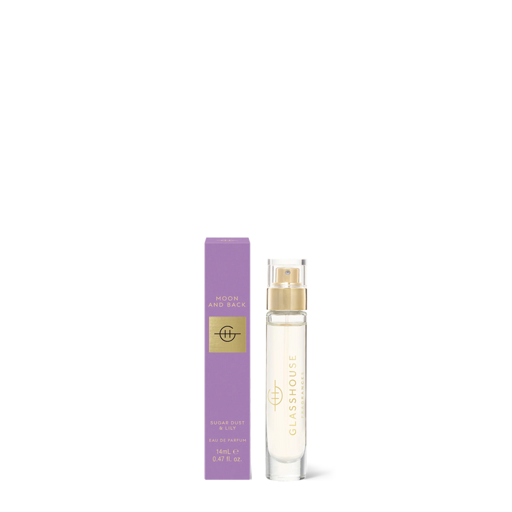 Commercial product photography by Glasshouse Fragrances of a 14mL Moon and Back Sugar Dust and Lily Eau de Parfum featuring a clear cylindrical glass bottle with a gold spray nozzle and its lavender box with gold foil lettering on a minimalist white background