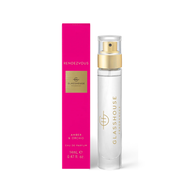 Commercial product photograph by Glasshouse Fragrances featuring the Rendezvous Amber &amp; Orchid Eau de Parfum against a white background, highlighted by its vibrant magenta slender box, a clear 14ml glass vial, and a polished gold-toned spray nozzle