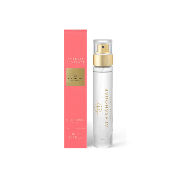 Product photograph by Glasshouse Fragrances of the Forever Florence Wild Peonies and Lily Eau de Parfum featuring a vibrant coral-pink box with gold foil branding and a slender glass bottle with a metallic gold spray nozzle on a white background