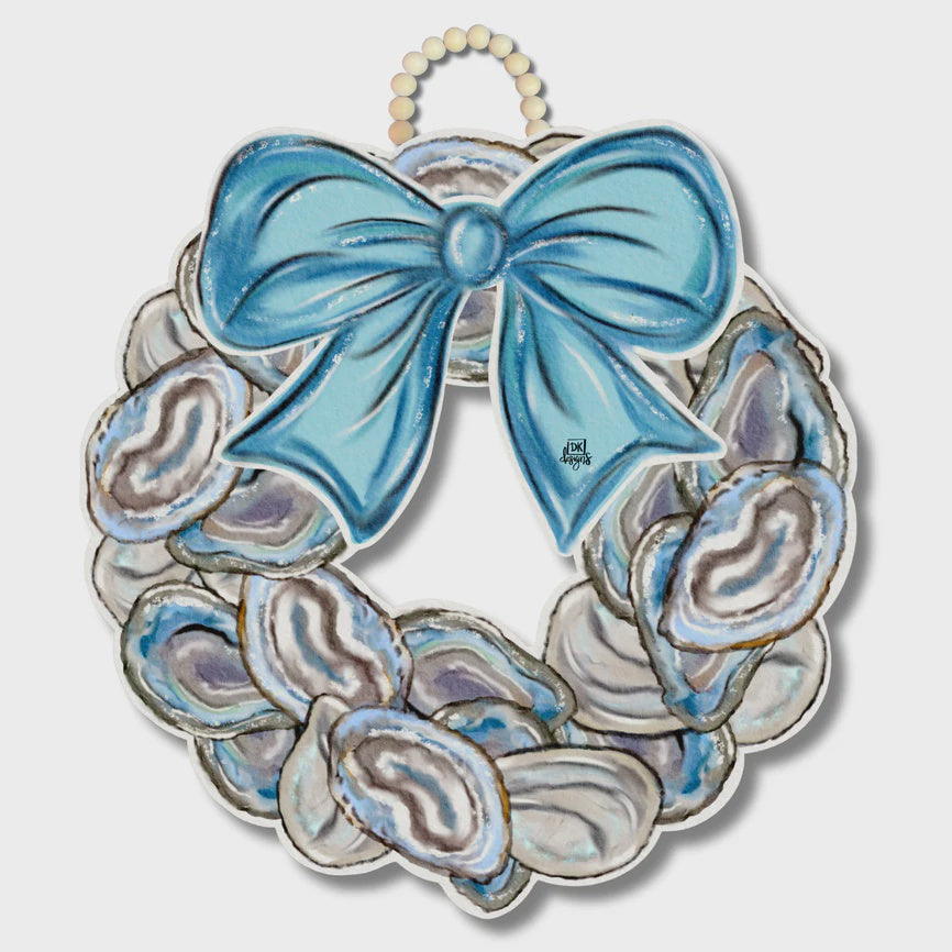 Digital illustration by DK Designs of a coastal oyster shell door wreath featuring a large sky-blue bow, iridescent purple-gray shell textures, and a light wood bead hanger