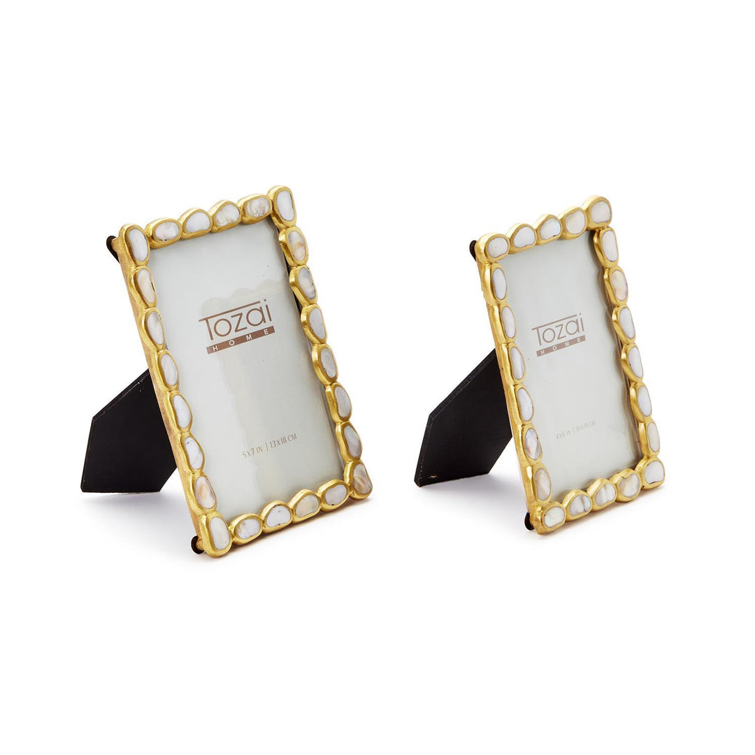 Mixed media frames by Tozai Home featuring two decorative gold-tone picture frames on a white background with scalloped edges and iridescent white mother-of-pearl shell inlays
