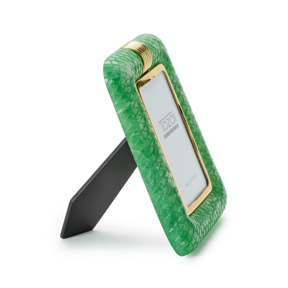 Tozai Home resin picture frame featuring a vibrant green diamond-textured border, a polished gold-tone ribbed top clip, and a black easel stand on a white studio background