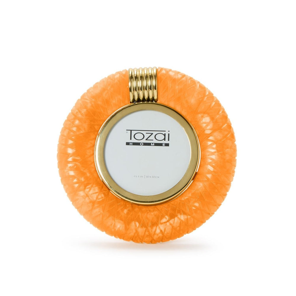 Hand-crafted resin by Tozai Home, this circular picture frame features a vibrant orange cross-hatch texture, a polished gold-tone inner rim, and a ribbed gold clip surrounding the Tozai Home logo against a white background