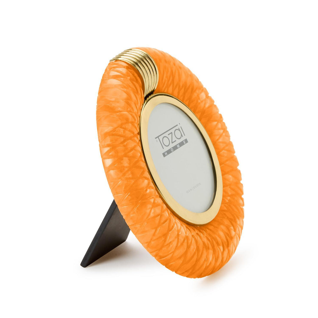 Tozai Home resin picture frame on a white background featuring a vibrant orange braided texture, a polished gold-toned inner rim, and a ribbed metal top accent