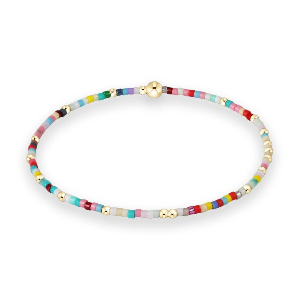 Handcrafted beaded jewelry featuring a vibrant multicolored seed bead bracelet accented with polished gold-tone spherical spacers and a central gold ball clasp on a white background