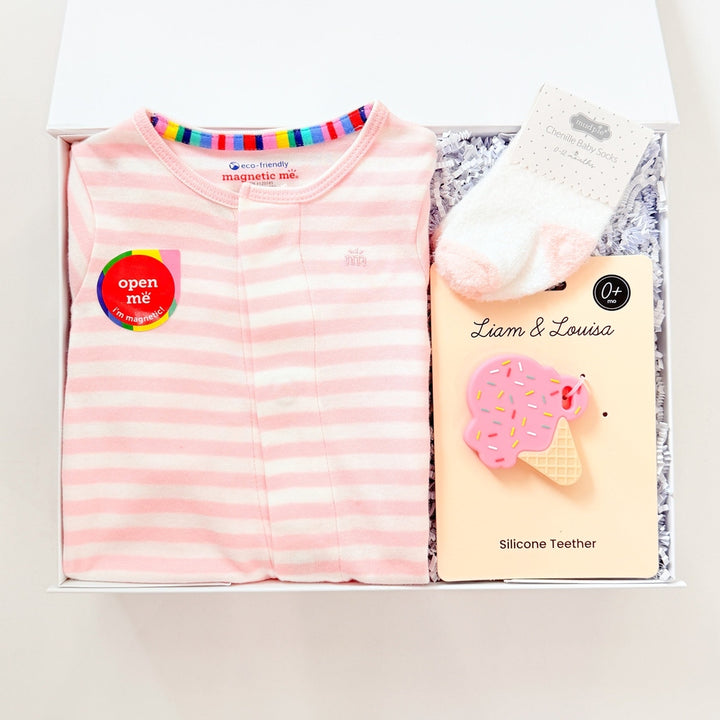 Pink striped shirt and white gloves in a box with &