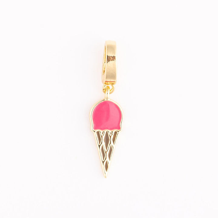 Gold-toned enamel jewelry charm of a miniature ice cream cone on a white background featuring a vibrant pink scoop and a detailed gold-etched waffle pattern dangling from a polished bail