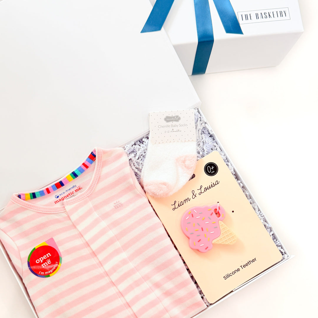 Pink striped shirt with accessories on a white background