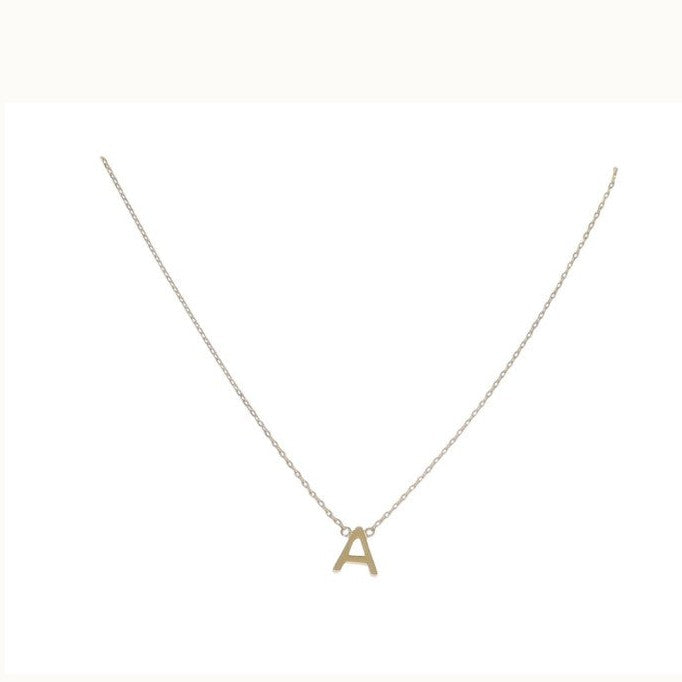 Gold-toned jewelry necklace featuring a polished block-style letter A pendant and a delicate cable chain presented on a clean white background with reflective metallic surfaces and a minimalist design