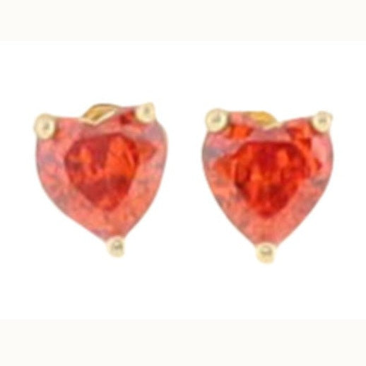 Jewelry piece showcasing a pair of heart-shaped vibrant red faceted gemstone earrings secured by three-prong yellow gold settings and presented on a plain white studio background