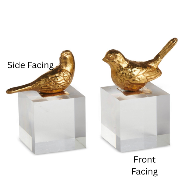 Gold-finished metal bird figurines mounted on transparent acrylic cube bases featuring detailed feather textures and a shimmering metallic surface presented in side and front-facing views