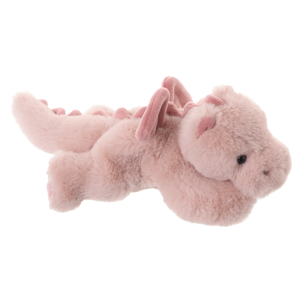 Plush stuffed animal by Jellycat of a dusty rose dragon lying on a white background featuring soft rounded wings, a row of fabric spines, and a fuzzy texture