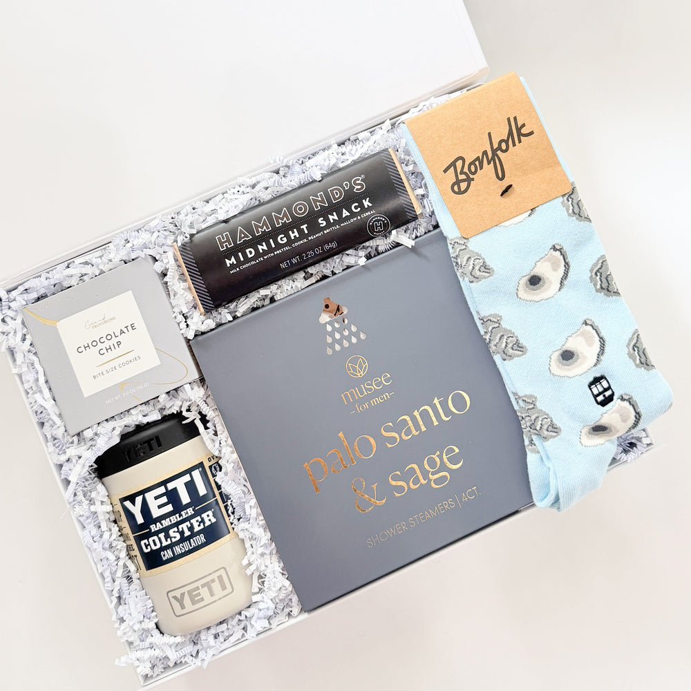 Gift set with YETI cup, Palo Santo & Sage box, and other items on a white background