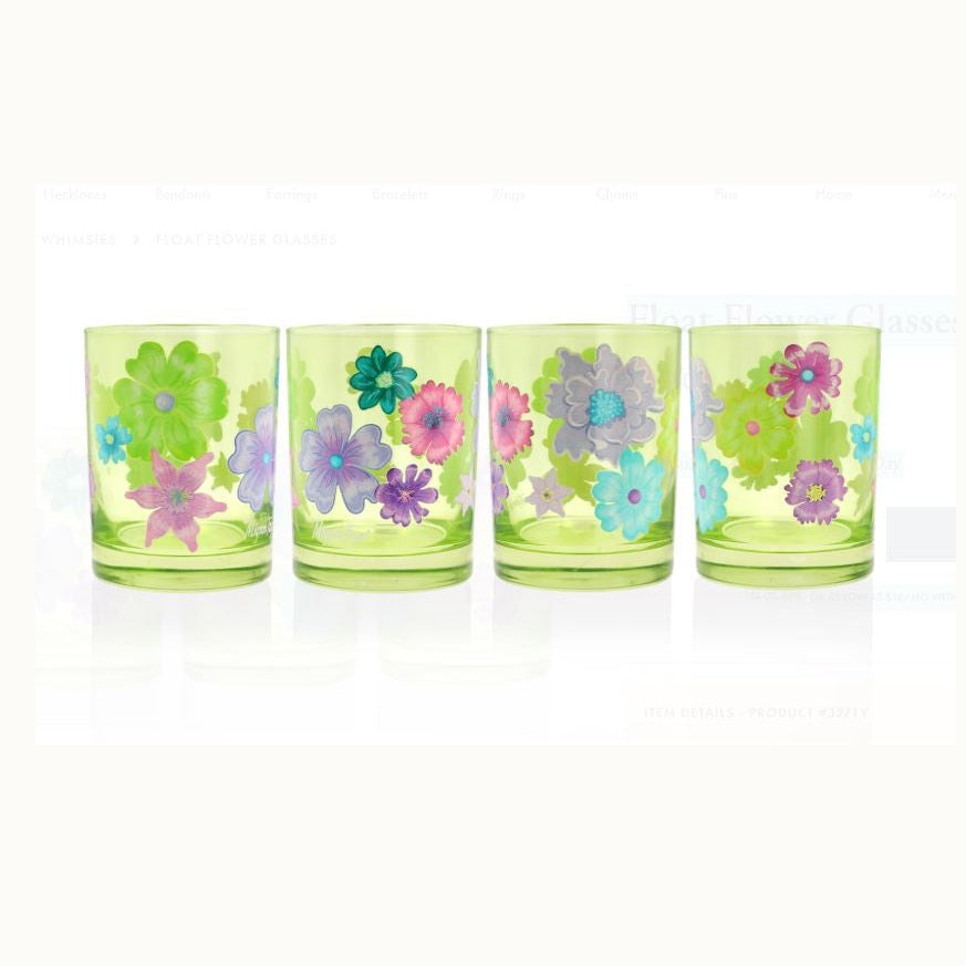 Hand-painted lime green tinted glassware by Mignon Faget featuring a set of four Float Flower glasses decorated with vibrant purple, pink, and teal floral illustrations on a reflective white background