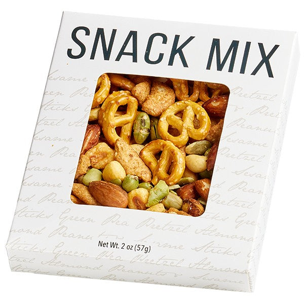 Studio product photograph of a white snack mix box on a white background featuring golden mini-pretzels, whole brown almonds, and vibrant green peas visible through a central square window