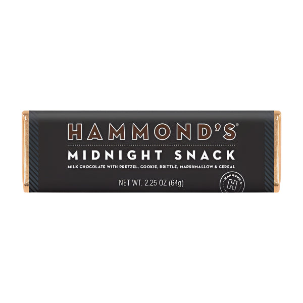 Product photograph of a Hammond's Midnight Snack milk chocolate bar on a white background featuring a black wrapper with bold white typography, copper-toned foil ends, and the iconic circular brand logo