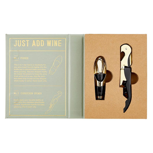 Product photograph of a Just Add Wine accessory kit featuring a gold-finished pourer and corkscrew nestled inside a sage green and kraft paper book-style gift box with gold instructional lettering