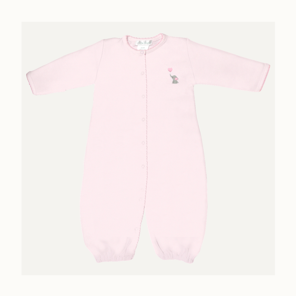 Pima cotton baby sleeper by Lyda Baby featuring a light pink long-sleeved design with an embroidered gray elephant holding a pink heart-shaped balloon and delicate scalloped trim along the snap-down front
