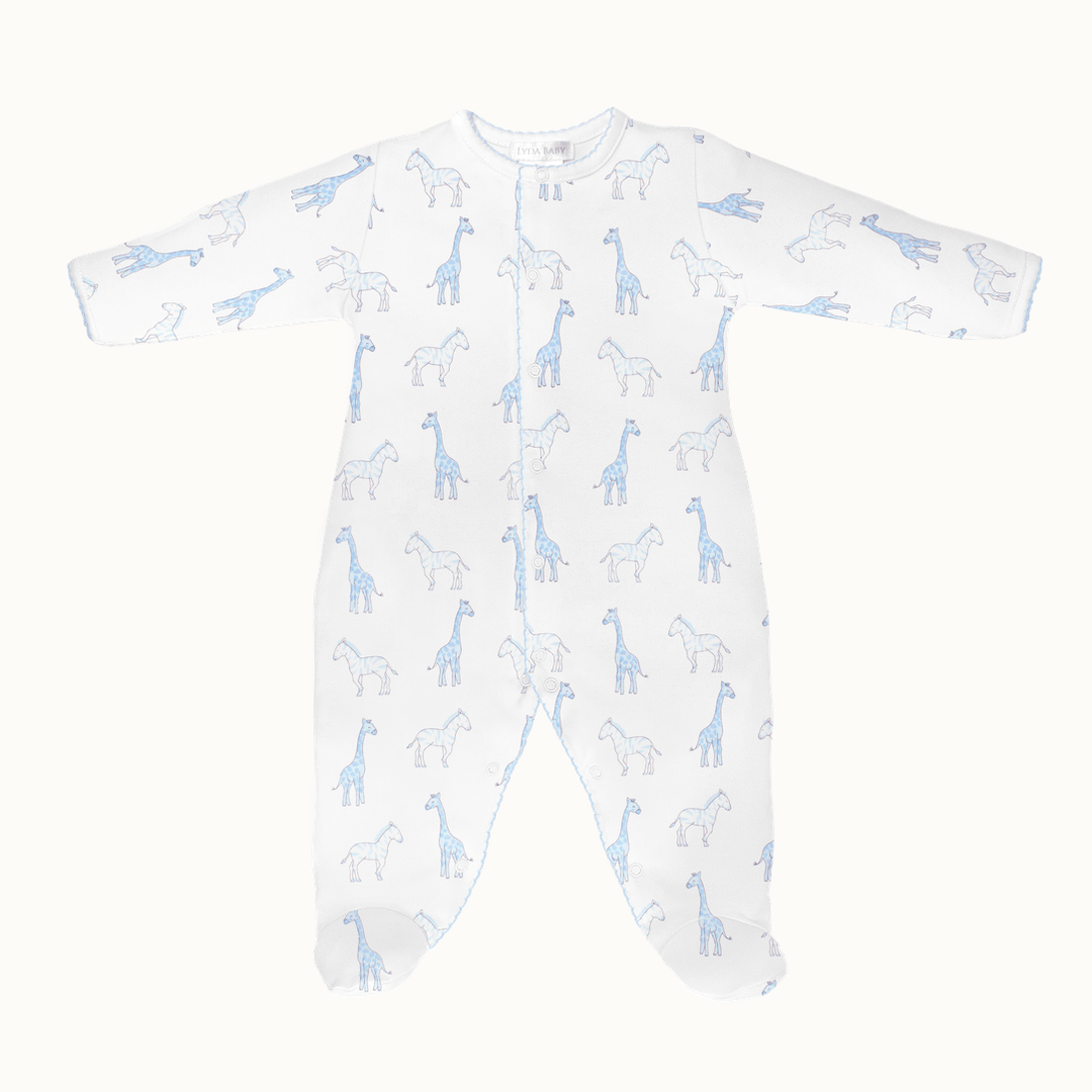 Cotton baby footie by Lyda Baby featuring a whimsical safari pattern of light blue giraffes and zebras on white fabric with a front-snap closure and delicate scalloped picot trim