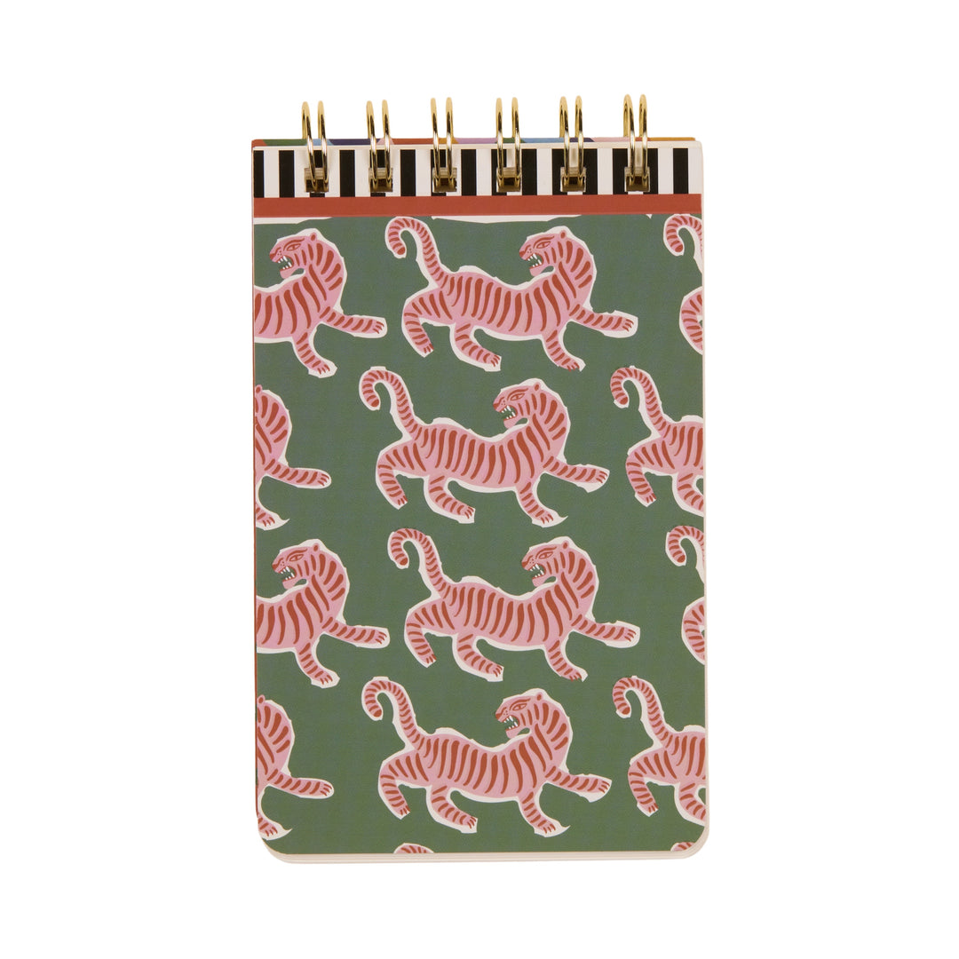 Illustrated top-spiral notebook by Rifle Paper Co featuring a repeating pattern of pink tigers on a sage green background with a black and white striped header and gold wire coils