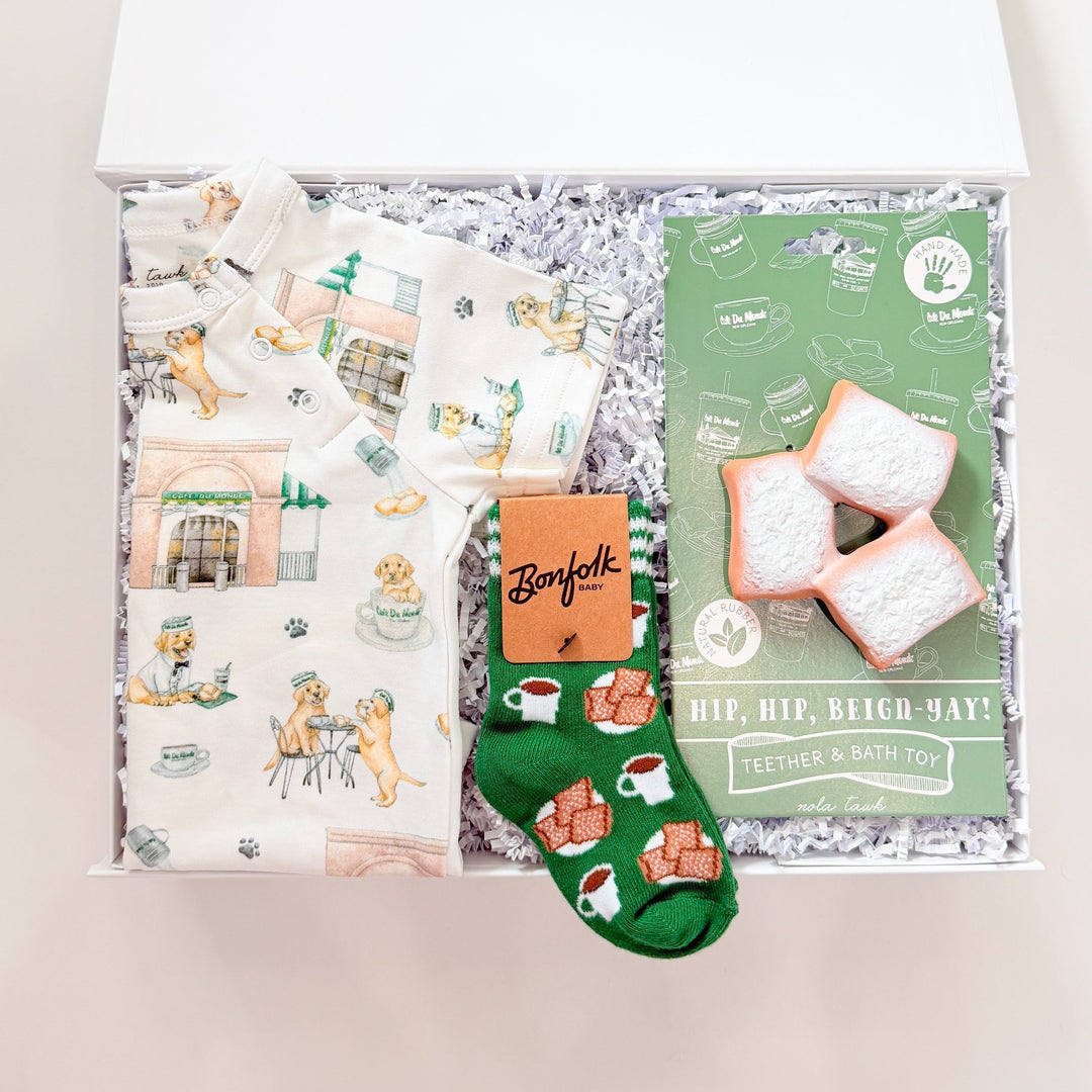 Gift box with socks, a card, and other items on a white background