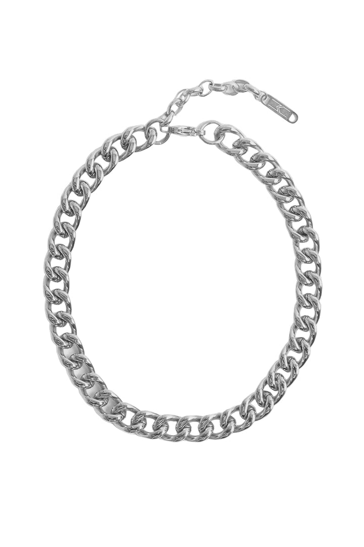 Polished silver metal necklace by Kendall + Kylie featuring a chunky curb chain on a white background with thick interlocking links and an adjustable lobster clasp extender with a signature geometric logo tag