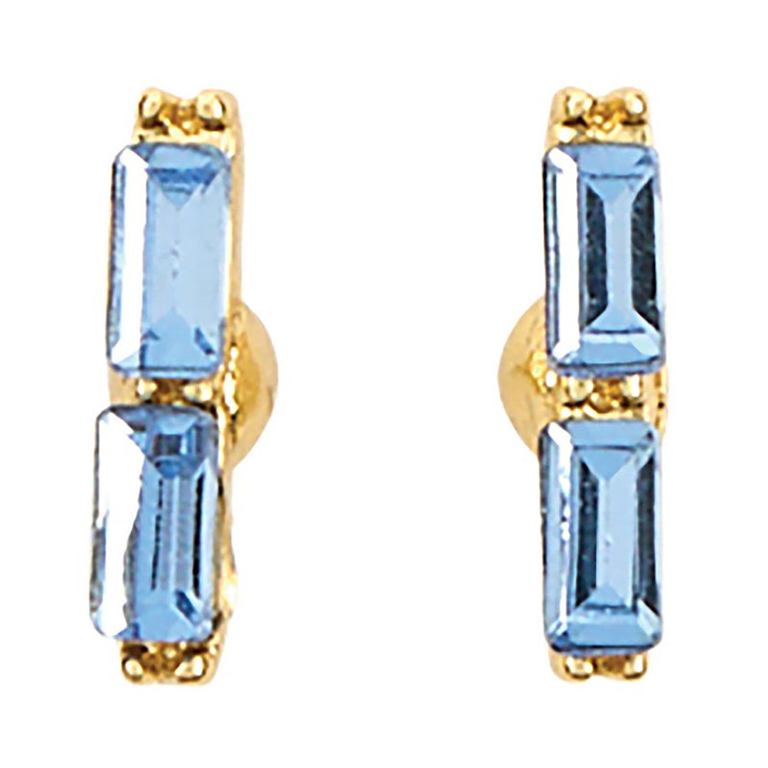 Jewelry pair of yellow gold-tone stud earrings featuring two vertically stacked light blue baguette-cut crystals with faceted surfaces and textured prong settings on a white background