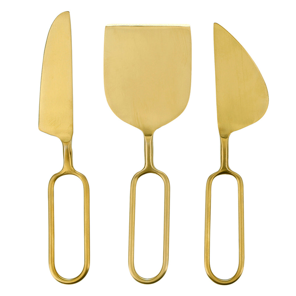 Brushed brass cheese knife set featuring three modern serving utensils on a white background with unique elongated open-loop handles and a matte gold finish