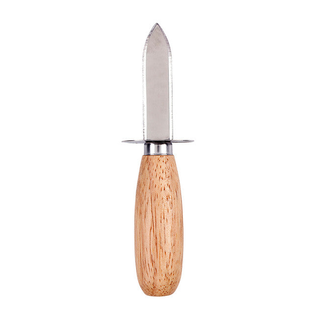 Studio photograph of an oyster shucking knife featuring a short pointed stainless steel blade, a thin metal hand guard, and a smooth rounded wooden handle with visible natural grain set against a plain white background