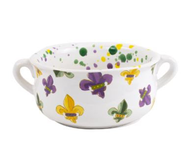 Hand-painted ceramic gumbo bowl featuring iconic New Orleans fleur-de-lis motifs in vibrant purple, green, and gold with side handles and a colorful paint-splattered interior