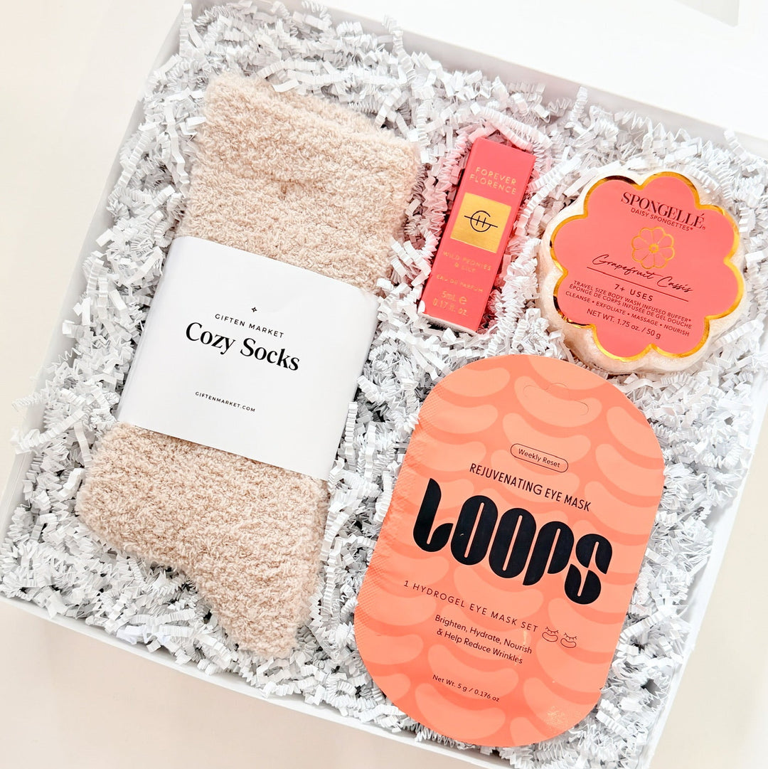 Set of cozy socks and sponge buffer in a gift box with &