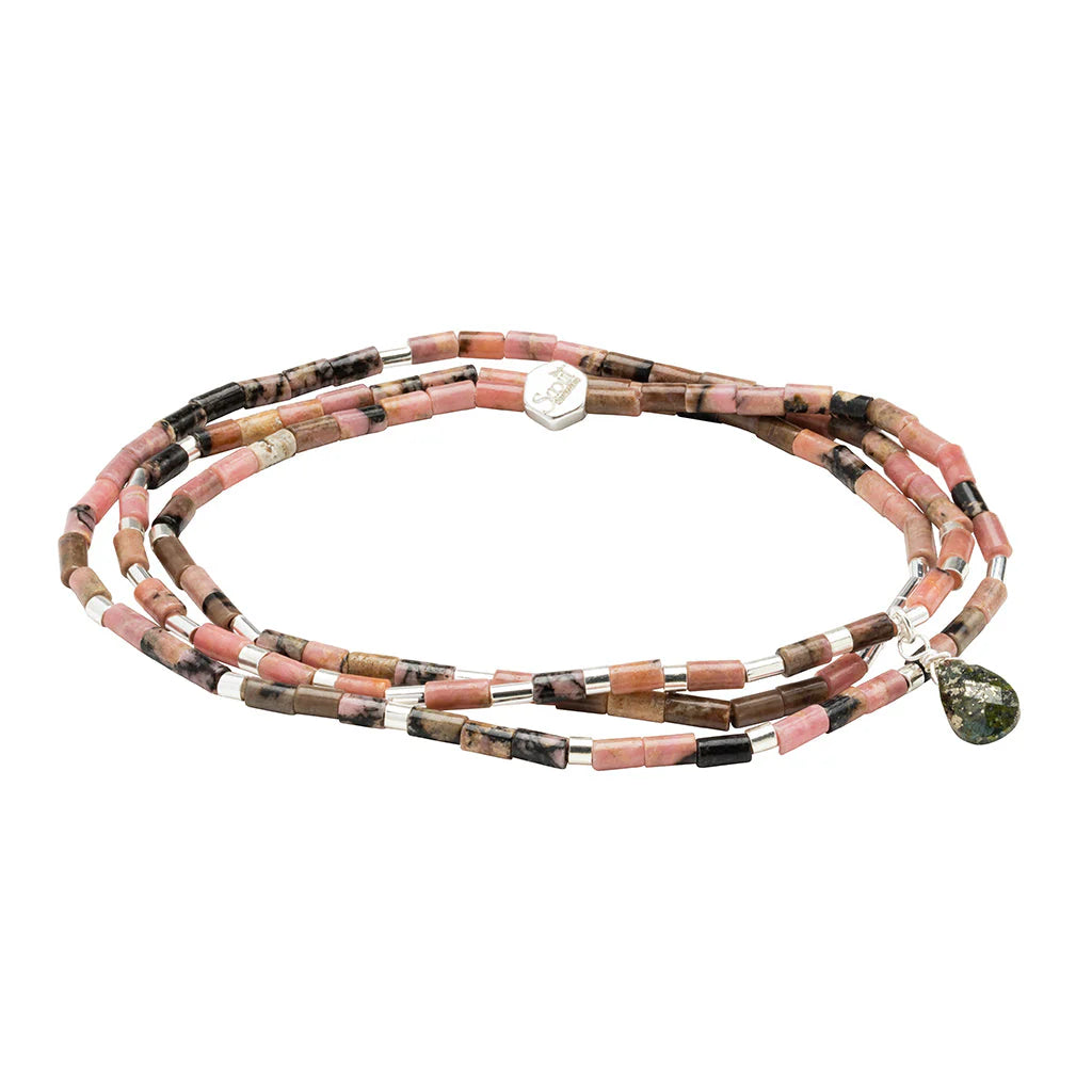 Beaded jewelry by Scout Curated Wear featuring a multi-strand rhodonite wrap bracelet on a white background with cylindrical pink and black stone beads, silver spacers, and a faceted green teardrop charm