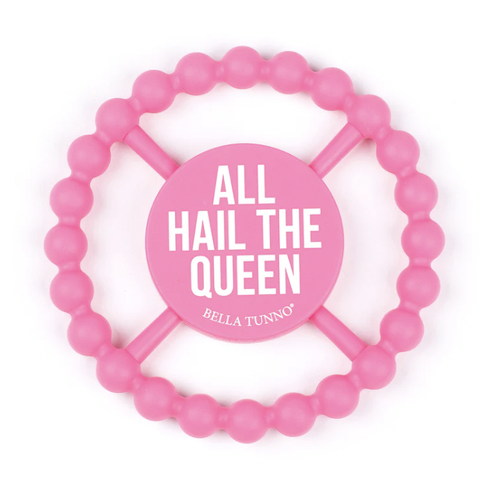 Silicone baby teether by Bella Tunno featuring a vibrant bubblegum pink circular design with a textured beaded outer ring and a central disc displaying the bold white phrase All Hail The Queen against a clean white background