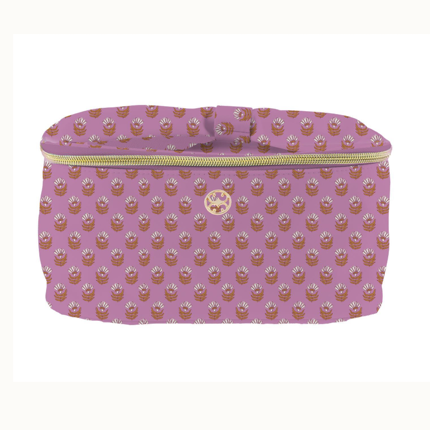 Elizabeth Scarlett fabric vanity bag on a white background featuring a repeating white and orange floral block print on a mauve base with a gold zipper and a central circular gold emblem