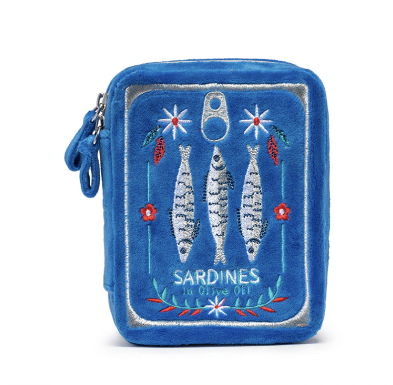 Embroidered plush pouch featuring a cobalt blue sardine tin design with three silver-stitched fish, red floral accents, and a metallic-threaded ring-pull against a white background