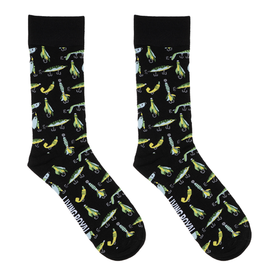 Living Royal brand printed crew socks featuring an all-over pattern of vibrant green and yellow fishing lures on a black background with white brand lettering on the footbed