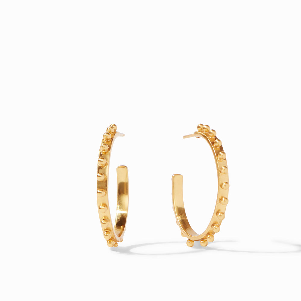 24K gold-plated brass earrings by Julie Vos featuring a pair of beaded hoops on a white background with a signature textured outer rim of raised studs and a polished open-back silhouette