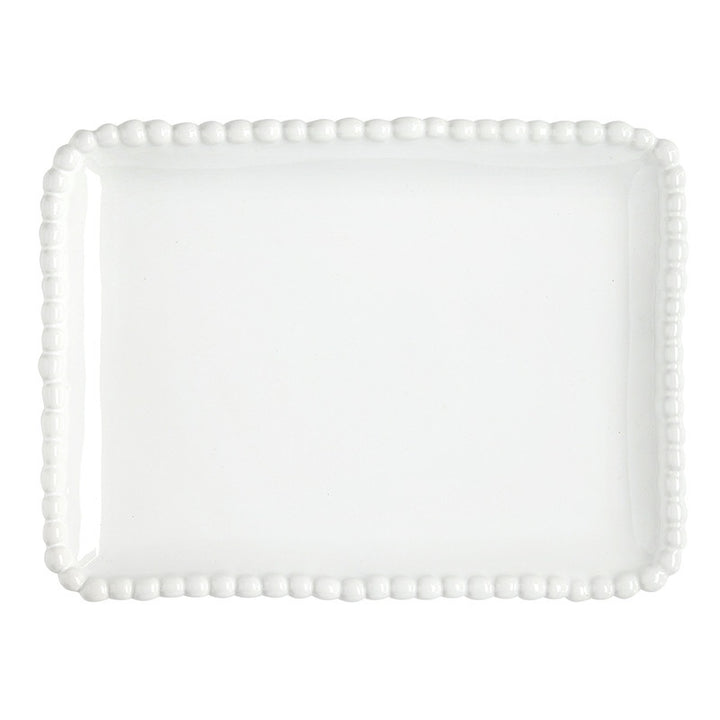 White glazed ceramic stoneware platter by Juliska featuring a rectangular serving tray with a raised berry-like beaded border and a glossy finish against a plain white background