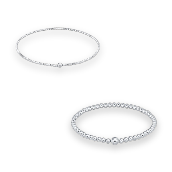 Professional jewelry photography of two sterling silver beaded bracelets on a white background featuring polished spherical beads of varying diameters and a single larger central focal bead on each strand