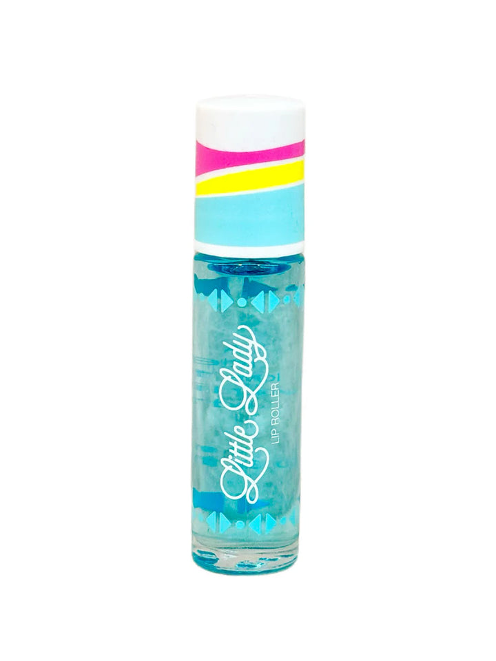 Product photograph of a Little Lady Lip Roller on a white background featuring a cap with magenta, yellow, and blue stripes and a clear tube containing turquoise liquid with white cursive branding and geometric blue patterns