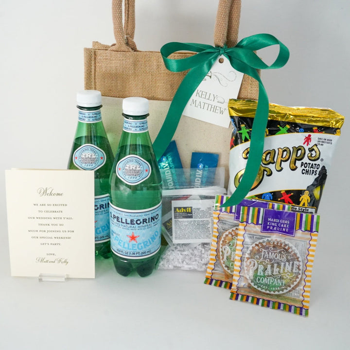 Digital photograph of a wedding welcome gift bag in a white studio setting featuring S.Pellegrino water, Zapp&