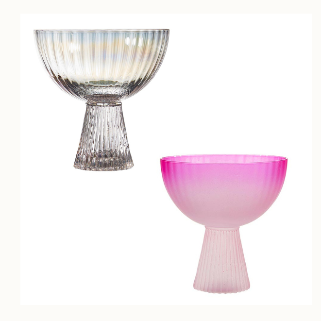 Glass decorative fluted bowls on a white background featuring one with an iridescent pearly finish and a second with a frosted pink gradient, both accented by textured conical bases